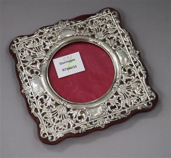 A George V silver photograph frame, with a shaped square pierced border, Chester, 1932, 17.7cm.